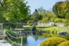 Reetanwesen im englischen Landhausstil mit Teich in Deichlage von Archsum - Garten