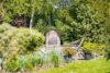 Reetanwesen im englischen Landhausstil mit Teich in Deichlage von Archsum - Garten