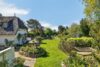 Reetanwesen im englischen Landhausstil mit Teich in Deichlage von Archsum - Garten