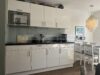 Zwischen Weststrand und Golfplatz – gepflegte Wohnung mit Südterrasse in Wenningstedt - Küche